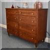 F59. Eight-drawer Mid Century dresser. 34”h x 43”w x17”d 